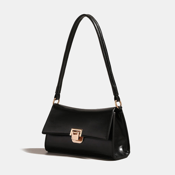 Black shoulder bag with gold-colored buckle – compact and chic