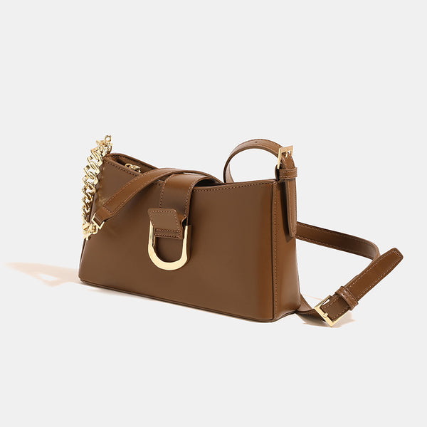 Brown shoulder bag with gold-colored chain and buckle detail