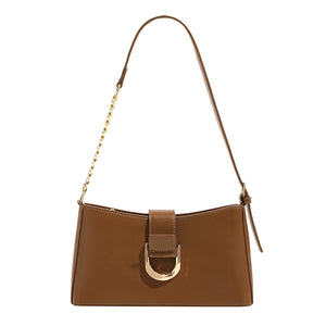 Brown shoulder bag with gold-colored chain and buckle detail